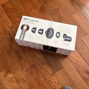 Dyson Supersonic Hair Dryer in Silver and Black with Copper Accents. Brand new!